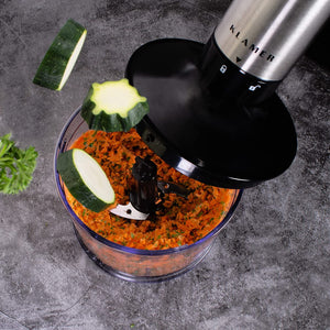 Stabmixerset 4-teilig 1000 Watt in Aktion mit zerkleinertem Gemüse und Mixeraufsatz.